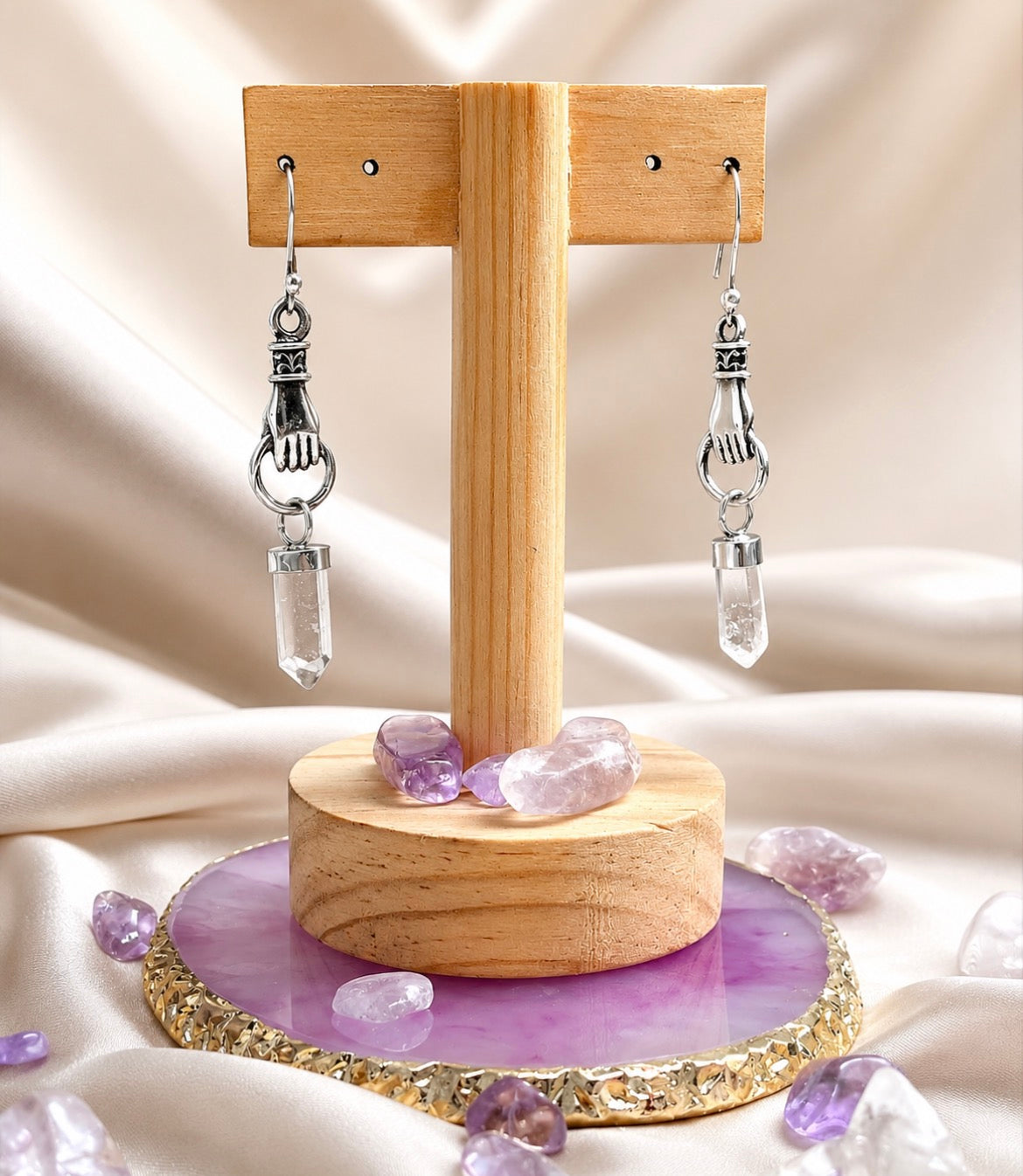 Aretes mano divina