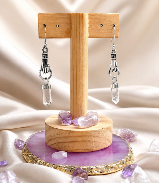 Aretes mano divina